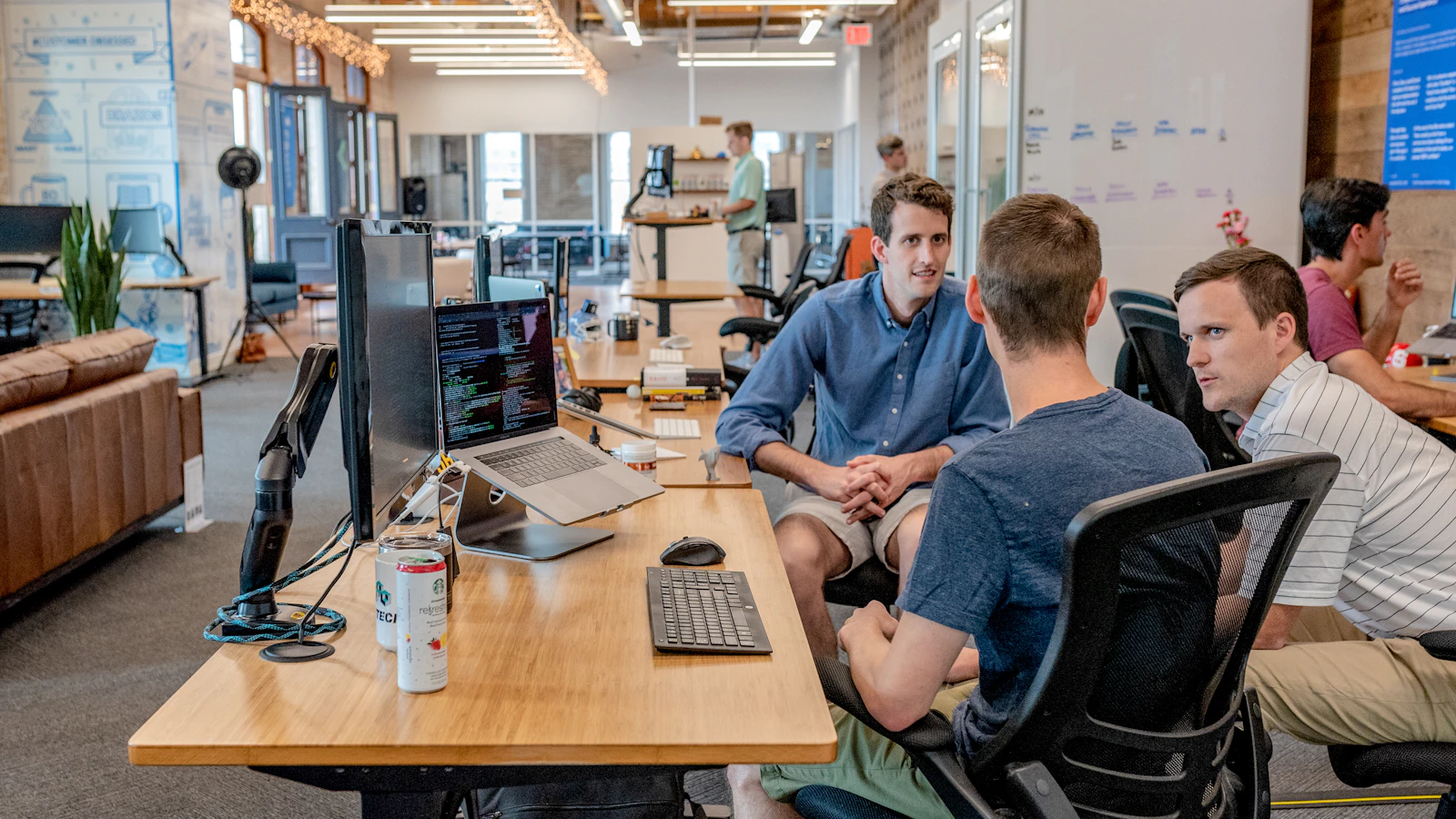 Small business team reviewing an AI-assisted customer retention and follow-up plan in a bright office