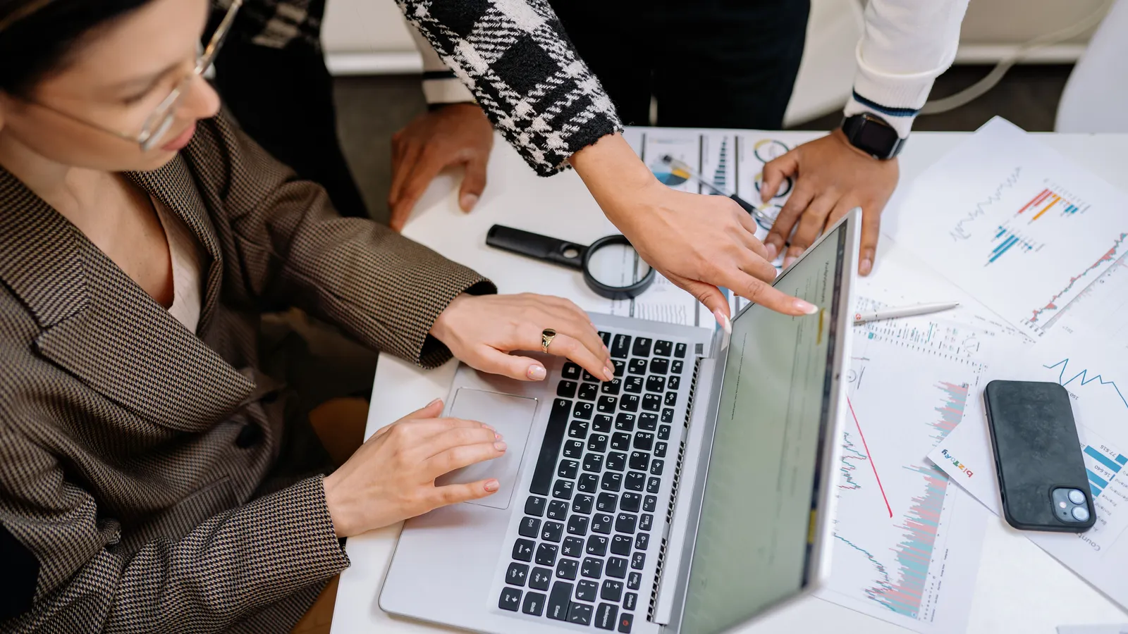Small business team organizing documents and approved answers for an AI knowledge base