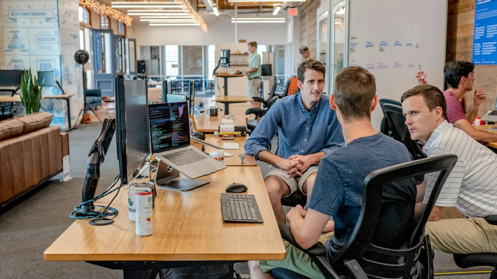 Small-business owner and manager reviewing service pricing and offer options together