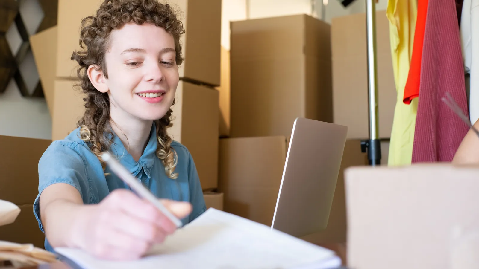 Small business owner using a laptop to manage orders and AI workflows